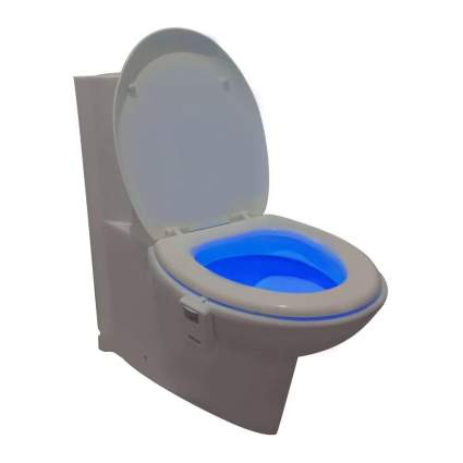 Toilet with glowing blue bowl